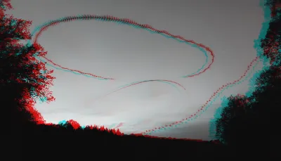 Trees border the left and right of the frame. Between that, tree bats flew. Two different species, with different flappy patterns. I stacked hundreds of video frames to show their fight patterns.